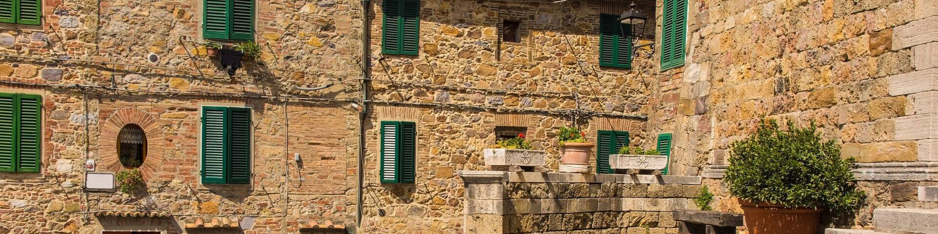 The steps of the Parish Church in the historic centre of the medieval town of Monticiano in Siena Province, Tuscany, Italy. The church is know as Parrocchia e Chiesa di Santi Giusto e Clemente - Churc