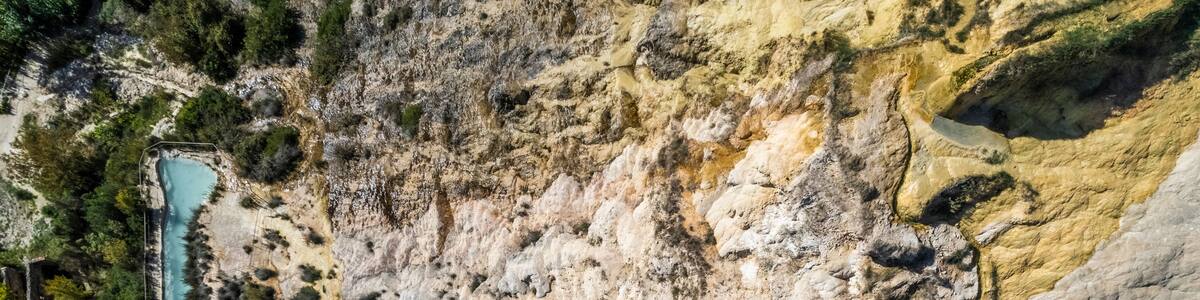 Aerial view of Bagno Vignoni, a hot thermal area with natural swimming pool in San Quirico d'Orcia, Val d'Orcia, Tuscany, Italy.