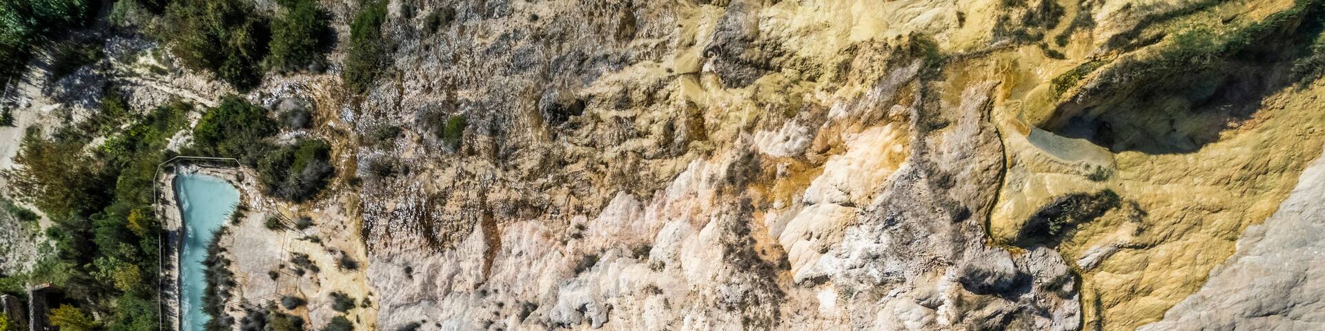 Aerial view of Bagno Vignoni, a hot thermal area with natural swimming pool in San Quirico d'Orcia, Val d'Orcia, Tuscany, Italy.