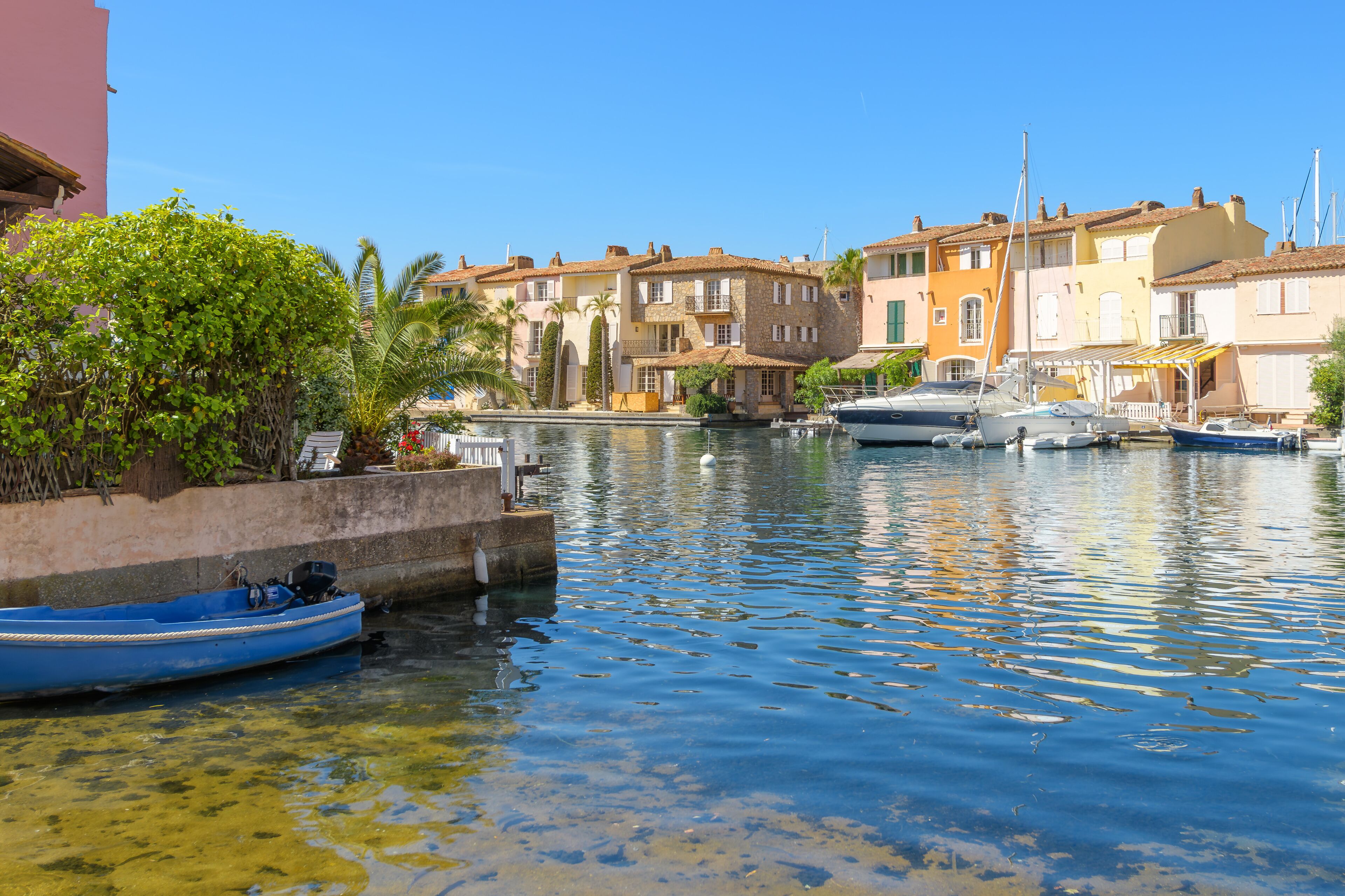 Colorful seaside homes with waterfront docks along the Mediterranean sea at Port Grimaud, France, the "Venice of Provence" of the French Riviera, Cote d'Azur.