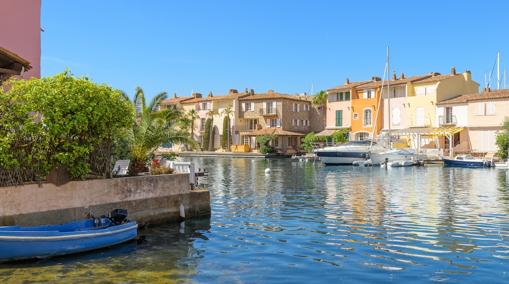 Colorful seaside homes with waterfront docks along the Mediterranean sea at Port Grimaud, France, the "Venice of Provence" of the French Riviera, Cote d'Azur.
