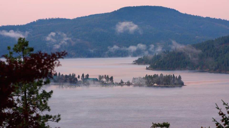 A lake surrounded by forested hills.