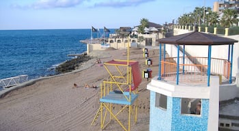 Bugibba which includes rugged coastline, views and a beach