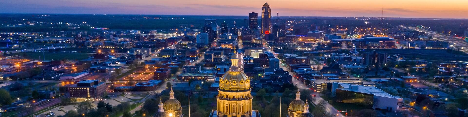 Aerial view of the Iowa State Capitol Building at Sunset with the Downtown Skyline Behind