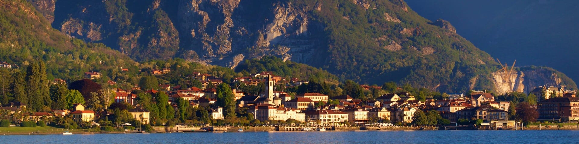 Baveno showing a small town or village, a sunset and mountains
