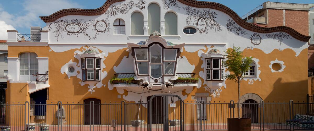 A building with ornate architectural details and a tiled roof.