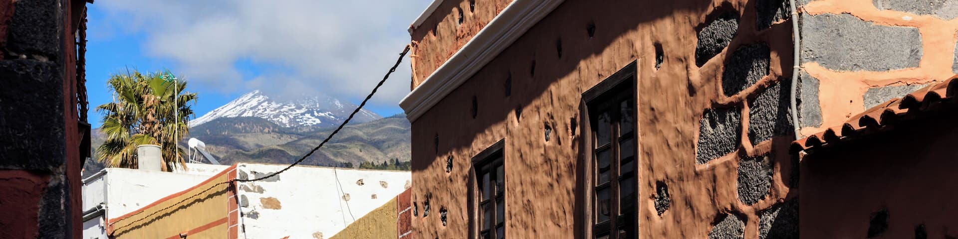 Summer cityscape on tropical island Tenerife, Canary in Spain. Street of old town Guia de Isora.