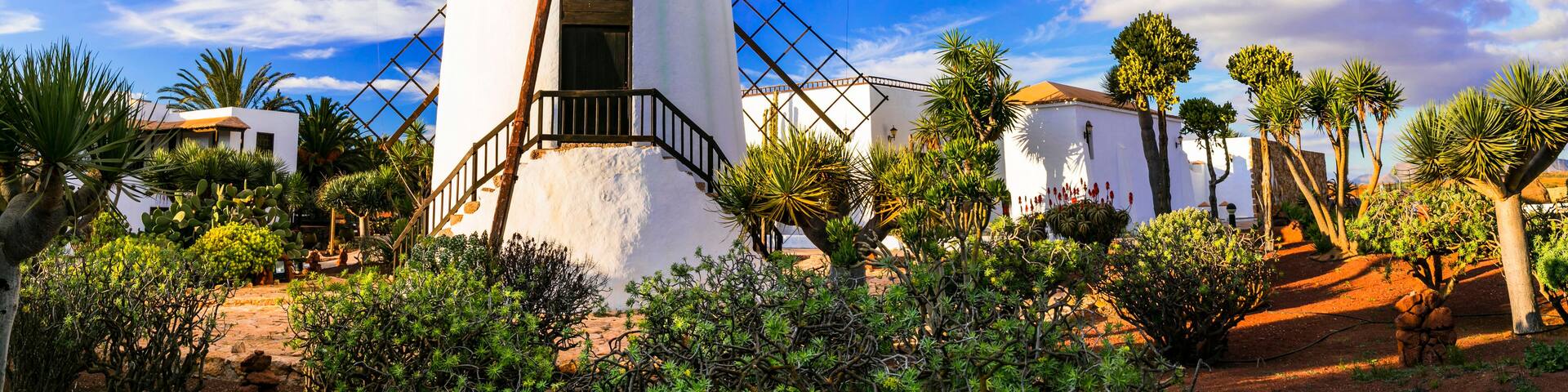 Traditional Windmill in Antigua Village: Iconic Molino on Fuerteventura Island. Historic Rural Architecture of the Canary Islands under Blue Sky, Spain