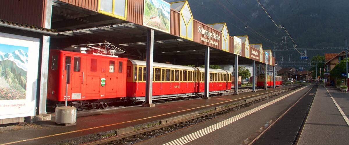 Wilderswil featuring mountains, signage and railway items