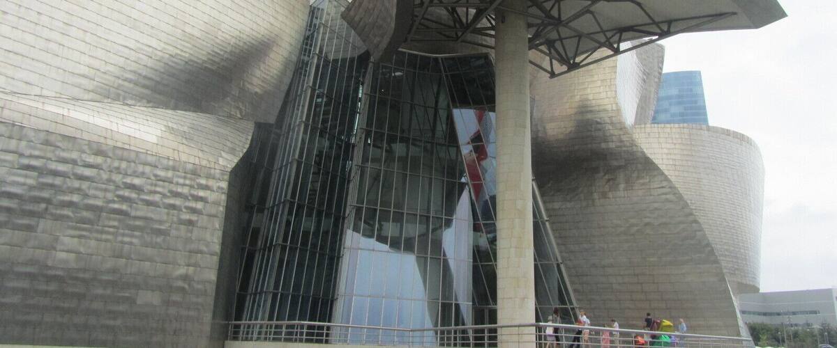 A modern architectural building with a unique, curved design.