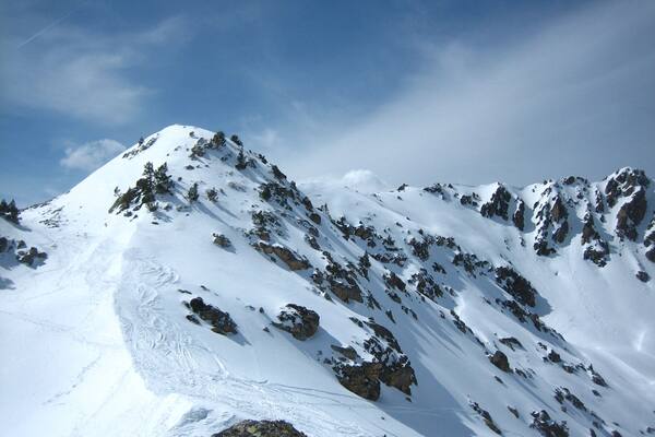 Snowy peak above ski station of La Mongie-Bareges.