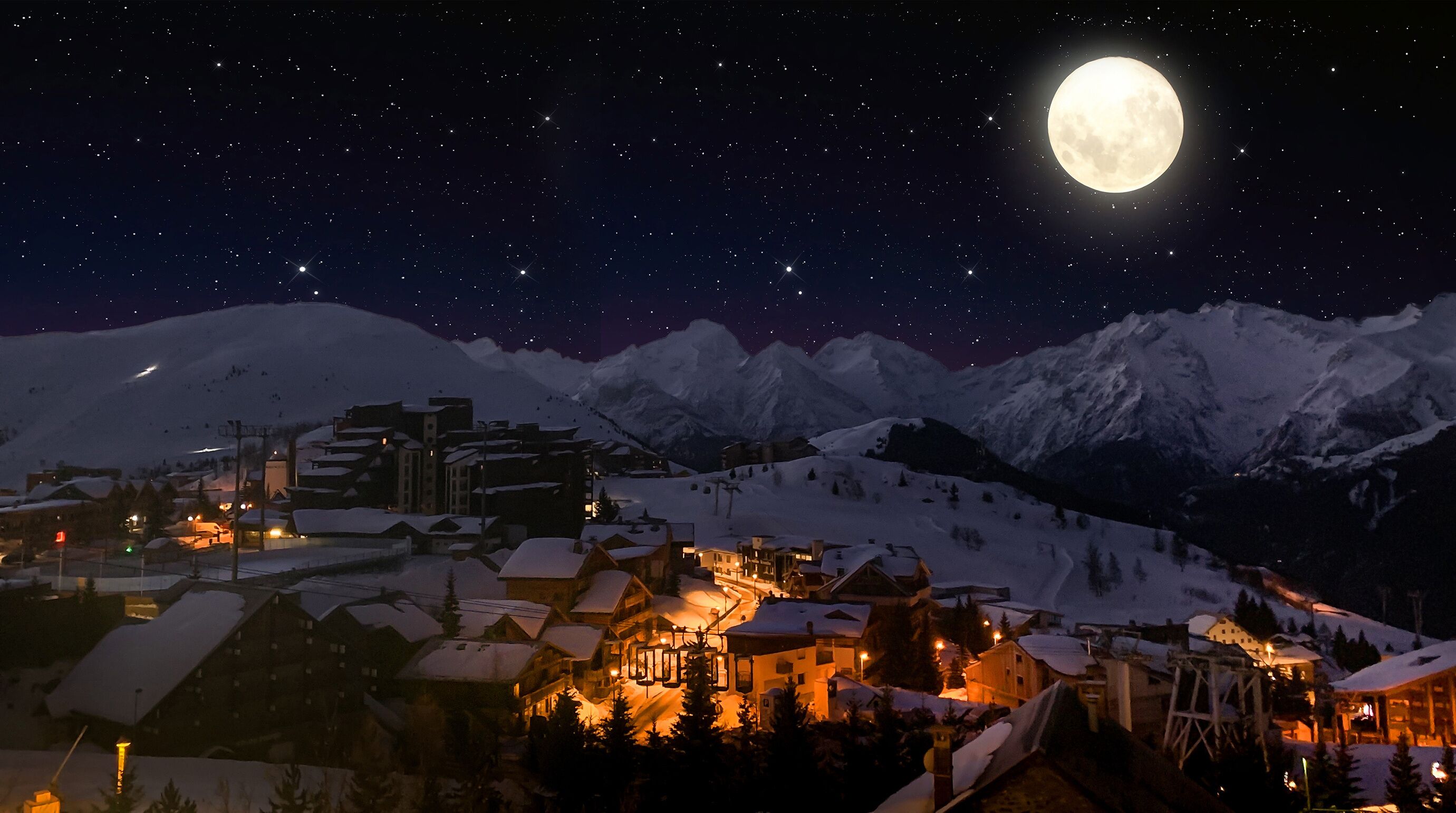 Night landscape and ski resort in French Alps, Alpes d'Huez, France, Huge Moon and Starry Sky