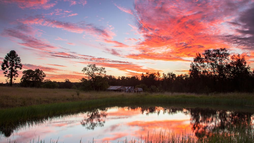 Beautiful sunset over Teds Hut and dam .Sedgefield near Singleton. Hunter Valley of N.S.W. Australia.