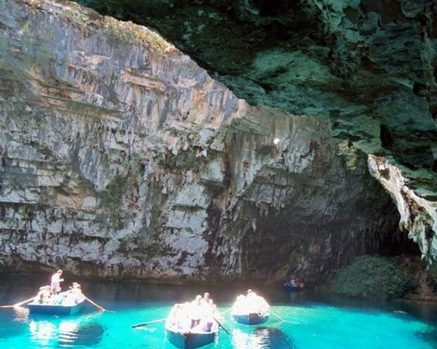 Lake Melissanis, Kephalonia
This is a lake secluded in a cave, located approximately two kilometers away  from Sami . The natural entrance to the cave has been created by the fall of a piece of its roof while an artificial entrance has also been constructed to facilitate  the visit of Melissani  . The cave is magically covered with stalactites, 160 meters long and 40 meters wide and reachable by small boats . The water is 39 meters deep. Main characteristic of the lake is the contrasting colors of the water when  the sunlight enters the cave from the open roof . 