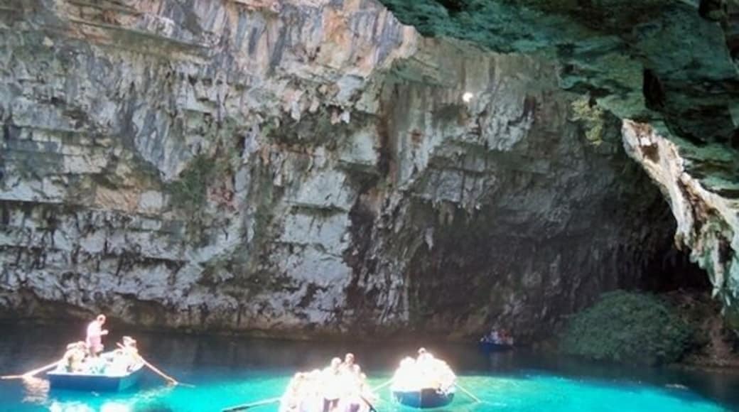 Lake Melissanis, Kephalonia
This is a lake secluded in a cave, located approximately two kilometers away from Sami . The natural entrance to the cave has been created by the fall of a piece of its roof while an artificial entrance has also been constructed to facilitate the visit of Melissani . The cave is magically covered with stalactites, 160 meters long and 40 meters wide and reachable by small boats . The water is 39 meters deep. Main characteristic of the lake is the contrasting colors of the water when the sunlight enters the cave from the open roof .