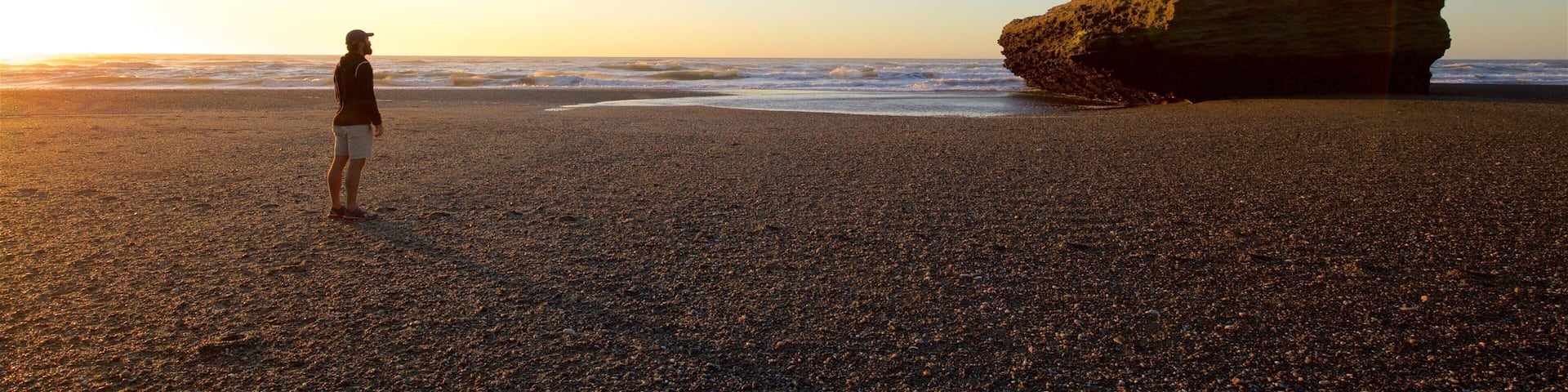 Punakaiki which includes a sunset and general coastal views