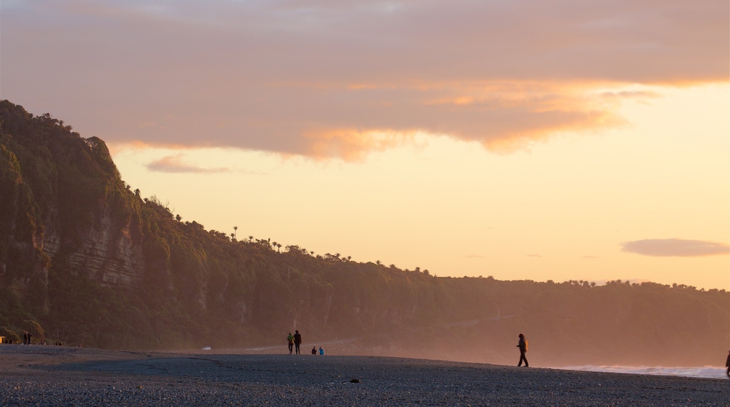 Punakaiki showing rugged coastline, a sunset and a bay or harbour