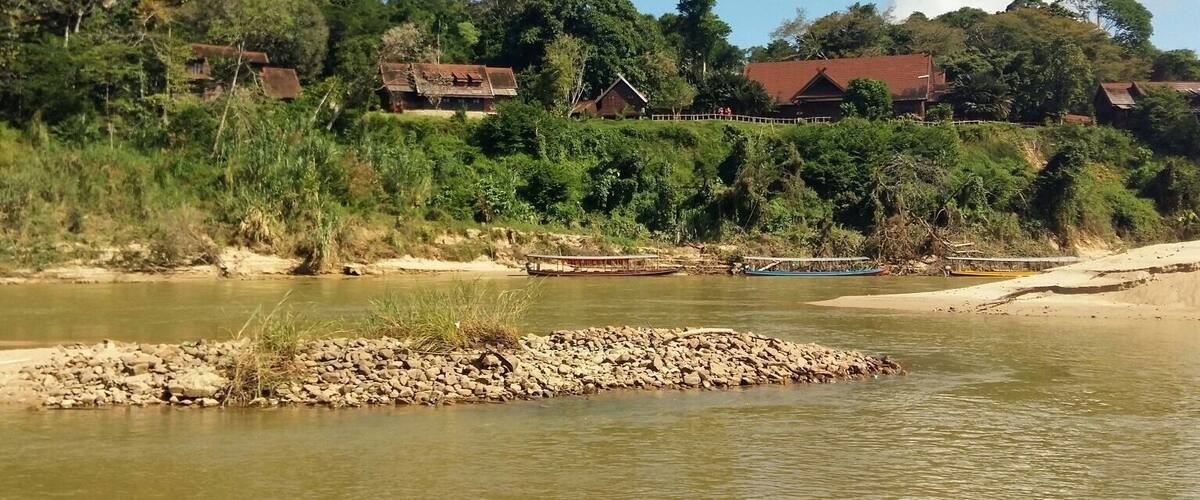 River crossing to Mutiara Taman Negara, a delightful eco-resort that blends right into the fringes of the world's oldest tropical Rainforest. Wake up to monkeys chattering and enjoying breakfast on the porch of your bungalow!