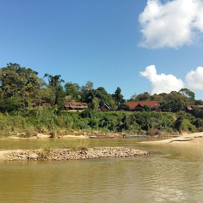 River crossing to Mutiara Taman Negara, a delightful eco-resort that blends right into the fringes of the world's oldest tropical Rainforest. Wake up to monkeys chattering and enjoying breakfast on the porch of your bungalow!