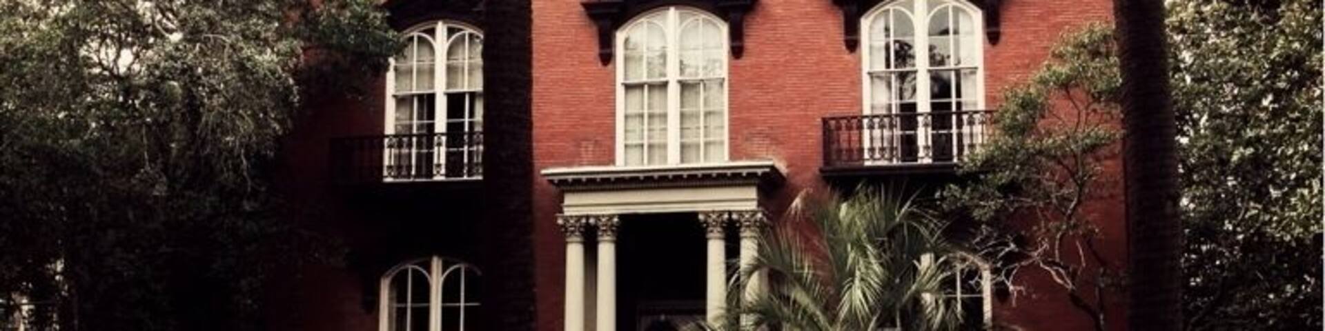 Designed by John S. Norris for General Hugh Weedon Mercer, construction of the house began in 1860. Construction was interrupted by the American Civil War, and finally completed around 1868 by the new owner, John Wilder.
Before Hansford's death, as retold in Midnight in the Garden of Good and Evil, the house had already been the scene of two deaths. In 1913, a previous owner tripped over the second floor banister, fractured his hip, and suffered a concussion, dying three days later. In 1964, a boy chasing pigeons on the roof fell over the edge and impaled himself on the iron fence below.