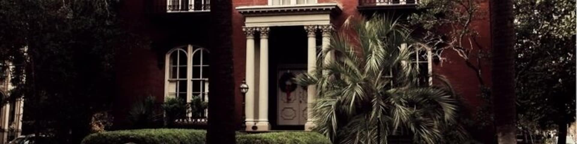 Designed by John S. Norris for General Hugh Weedon Mercer, construction of the house began in 1860. Construction was interrupted by the American Civil War, and finally completed around 1868 by the new owner, John Wilder.
Before Hansford's death, as retold in Midnight in the Garden of Good and Evil, the house had already been the scene of two deaths. In 1913, a previous owner tripped over the second floor banister, fractured his hip, and suffered a concussion, dying three days later. In 1964, a boy chasing pigeons on the roof fell over the edge and impaled himself on the iron fence below.