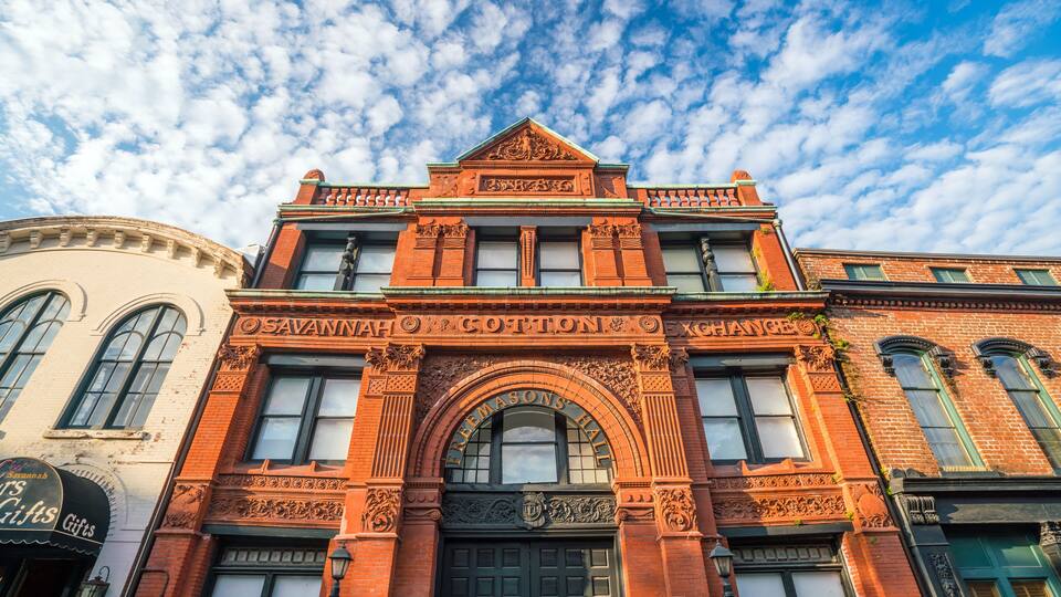 A historic building with ornate architecture and a large arched entrance.