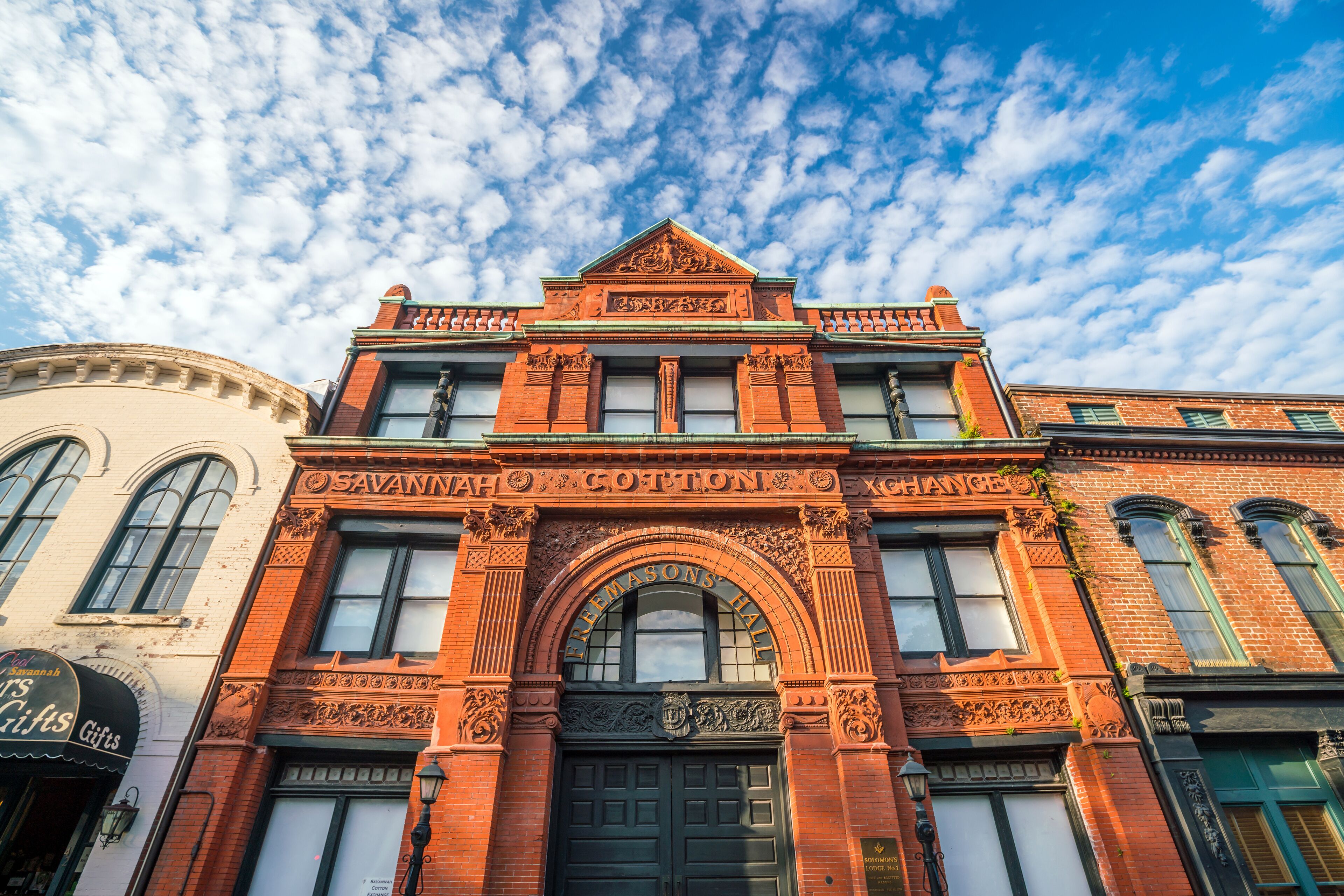 A historic building with ornate architecture and a large arched entrance.