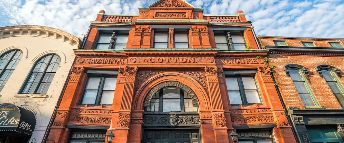 A historic building with ornate architecture and a large arched entrance.