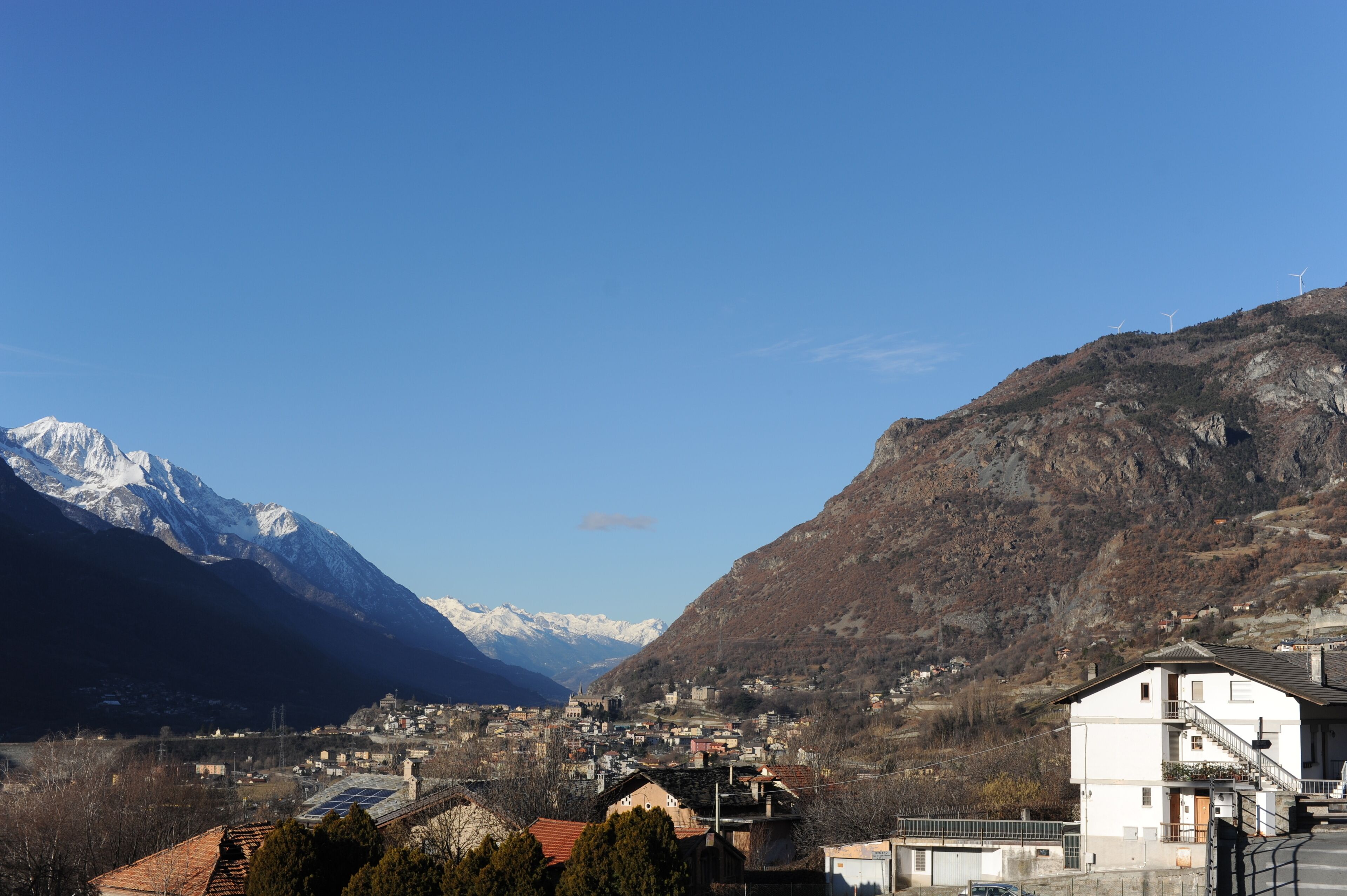 Panoramic view of Aosta valley (Valle d’Aosta) from Saint-Vincent in winter with Italian Alps in the background