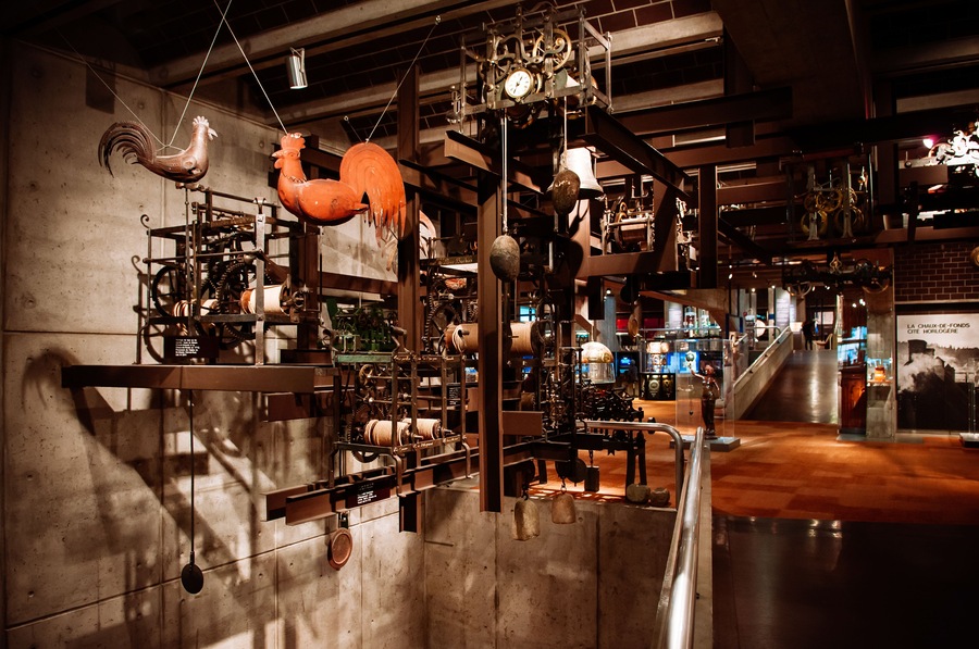 A museum exhibit with various mechanical devices and sculptures.