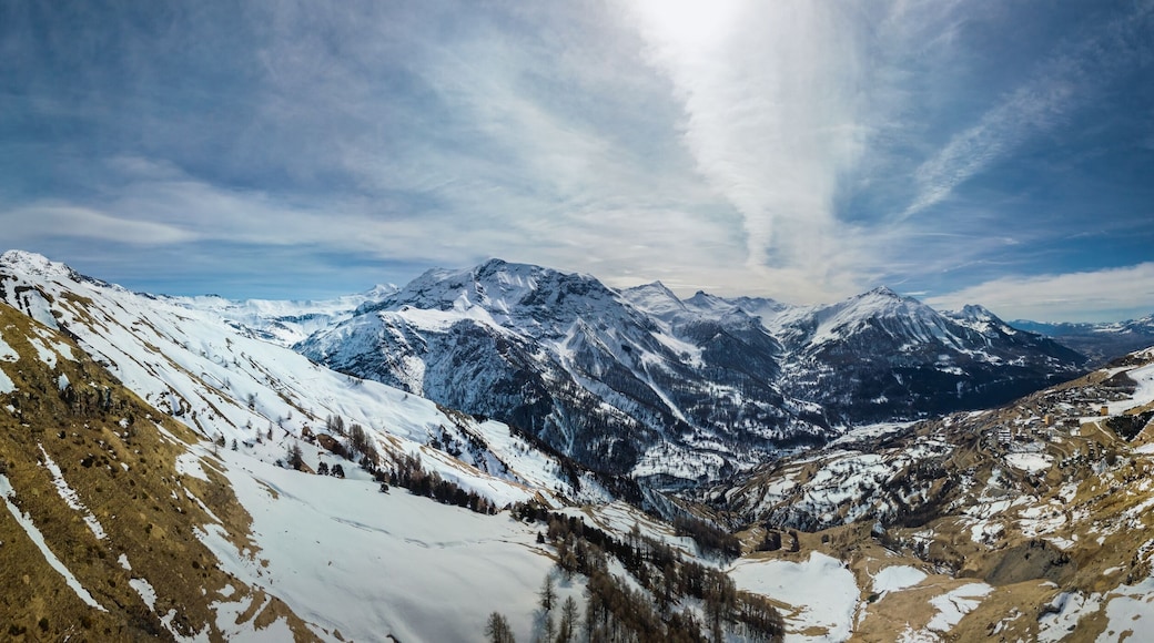 Panoramic drone view of the Alps with small village