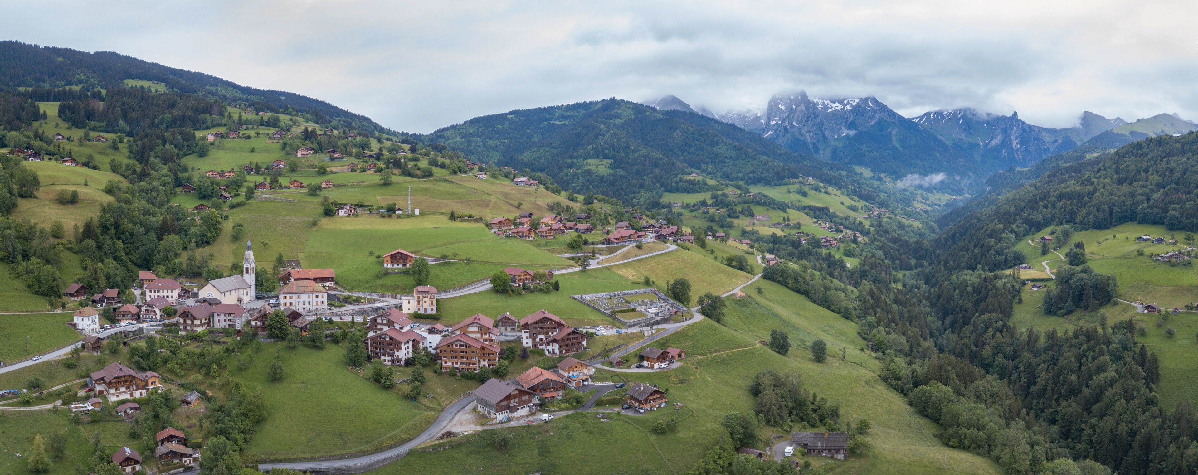 Alps panorama, scenic view of mountains and village