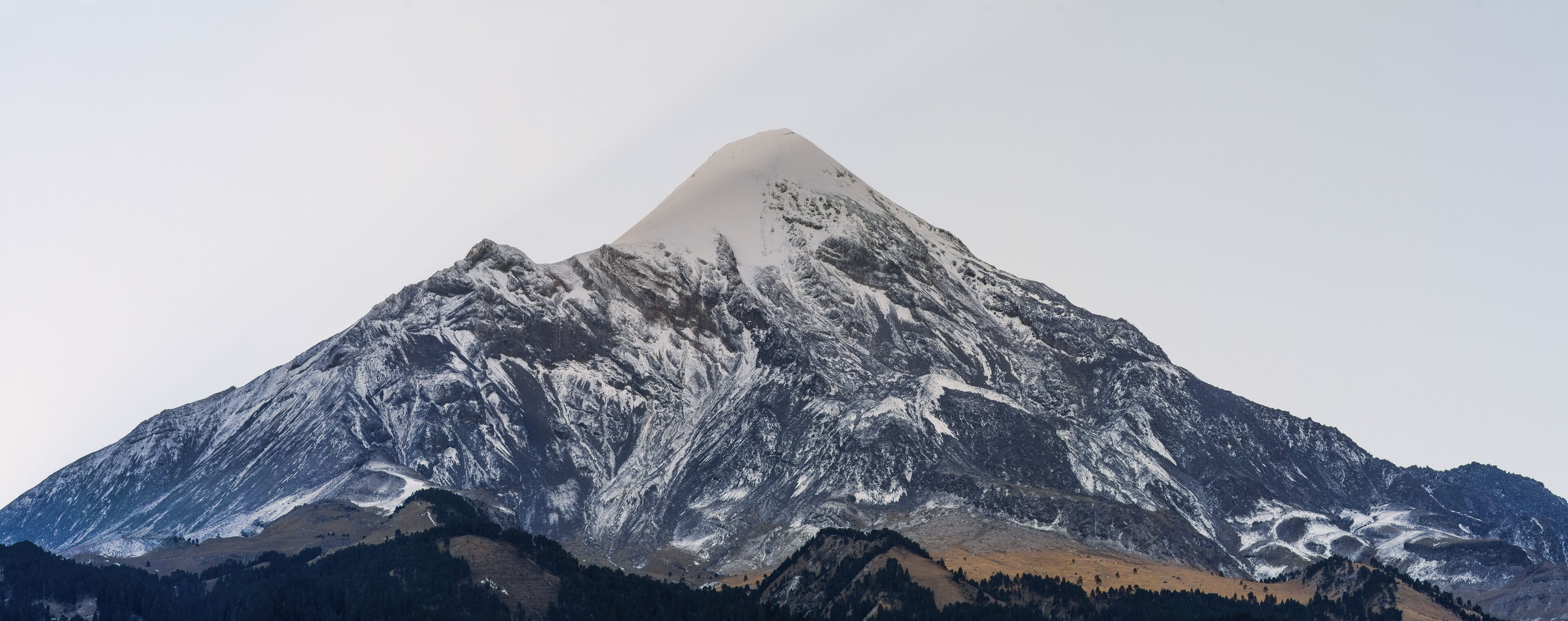 Contrasting panorama of Mexico's highest volcano - Pico de Orizaba before dawn.