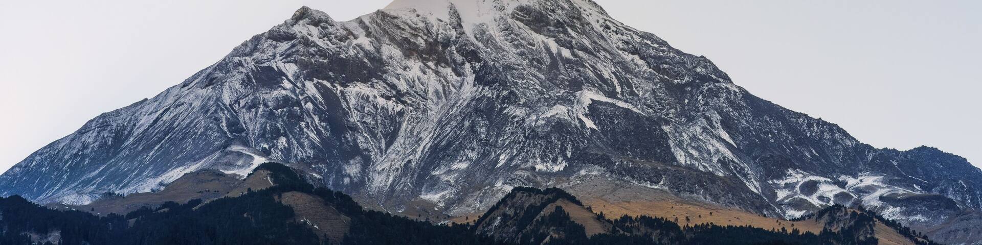 Contrasting panorama of Mexico's highest volcano - Pico de Orizaba before dawn.