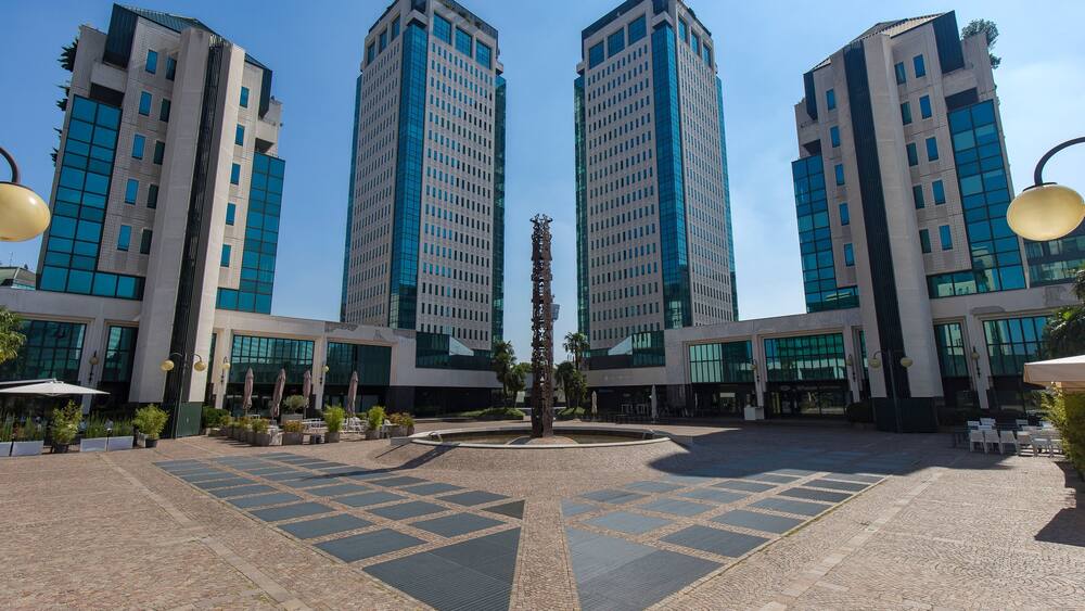 Vimercate, Italy - September 5, 2020: street view of the white towers, a shopping mall in the outskirts of Milan. No people are visible.