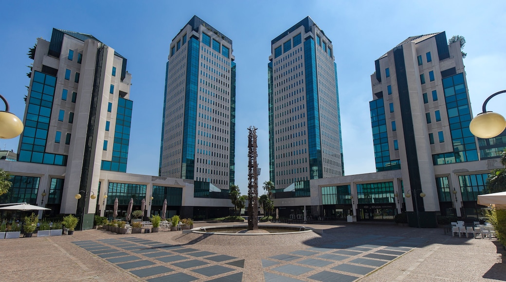 Vimercate, Italy - September 5, 2020: street view of the white towers, a shopping mall in the outskirts of Milan. No people are visible.