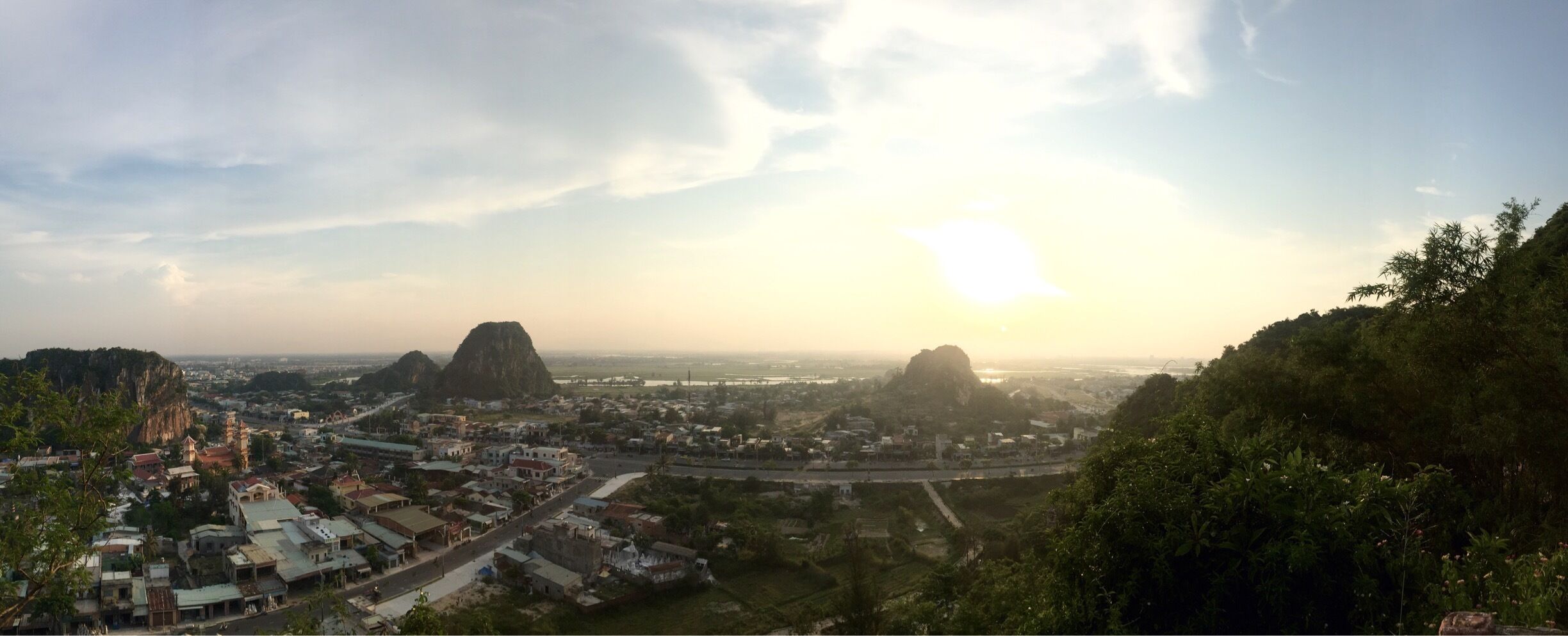 View from the top of Danang's Marble Mountains as the sun started to set. This attraction has pagodas, viewpoints, and numerous caves. 