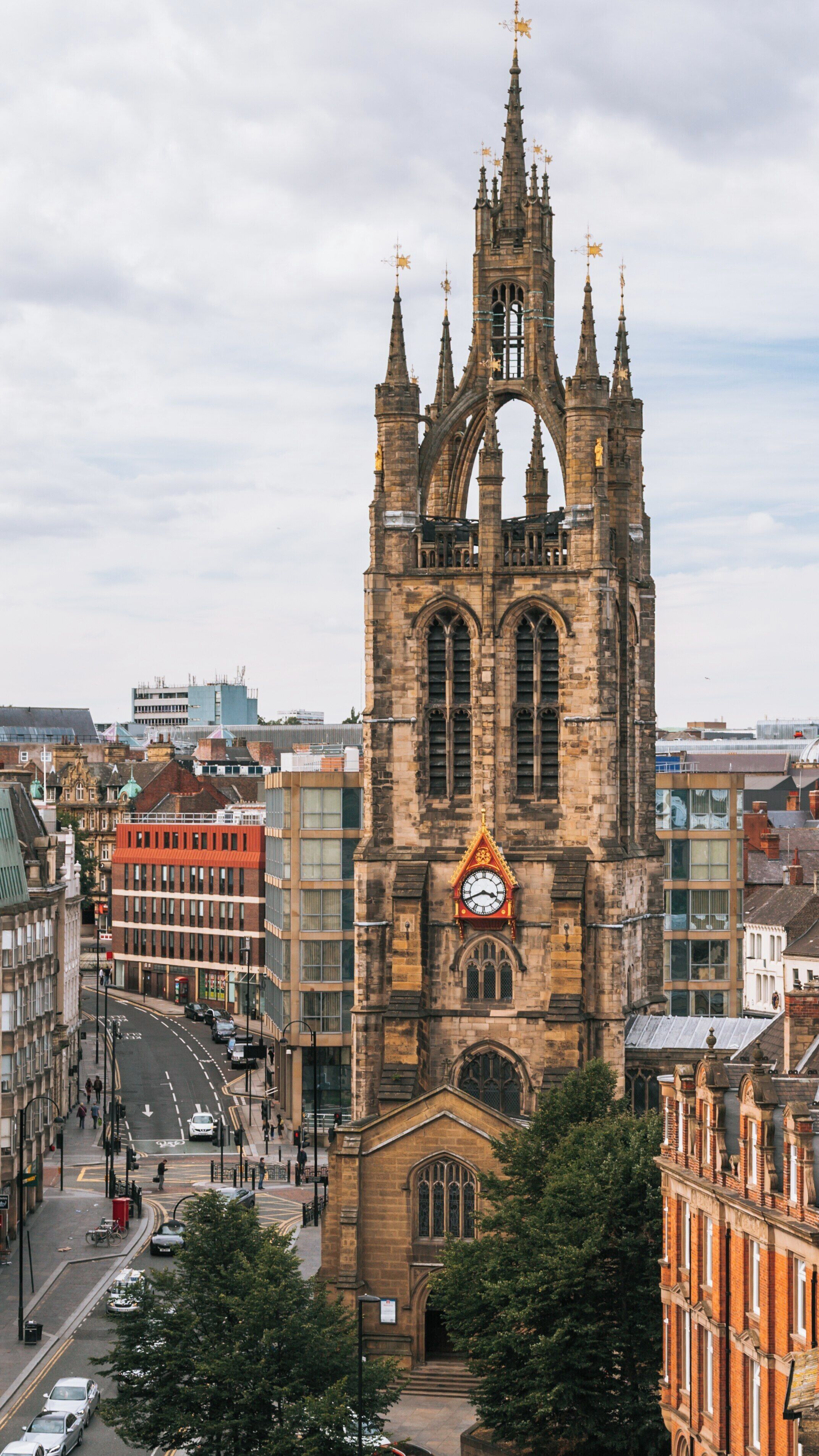 Newcastle-upon-Tyne St. Nicholas Cathedral towering over the city, showcasing historic architecture amidst modern surroundings in England