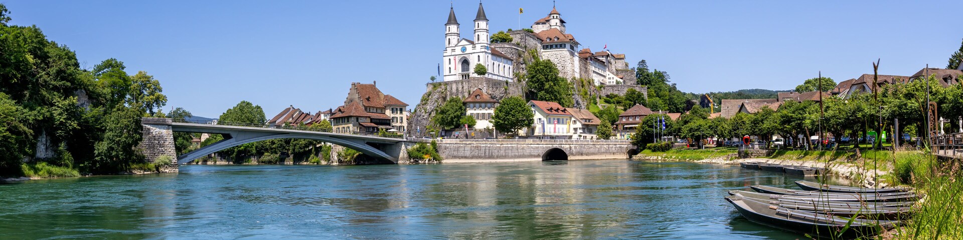 Aarburg city on the river Aare with church, fortress and boats panorama in Switzerland
