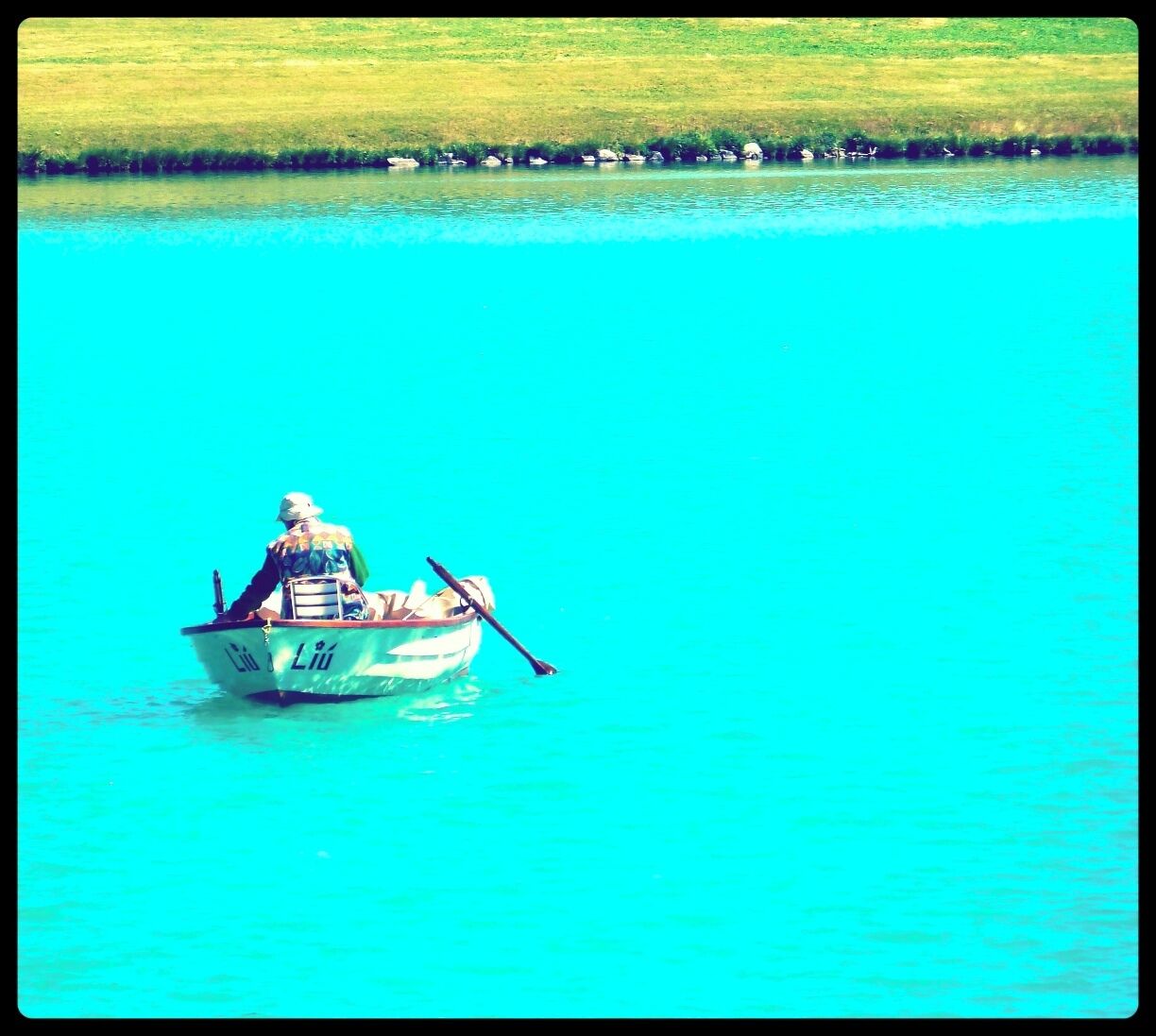 Boatman at the crystal clear waters of the Silvaplana Lake. Love this place, ideal for a stop and enjoy amazing views

