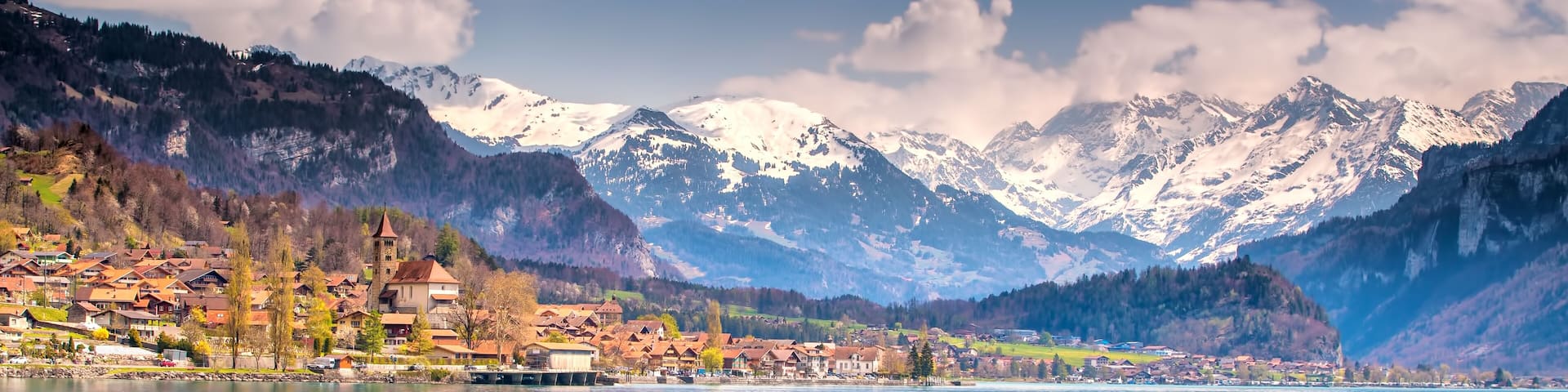 Brienz town on lake Brienz by Interlaken with the Swiss Alps covered by snow in the background, Switzerland, Europe