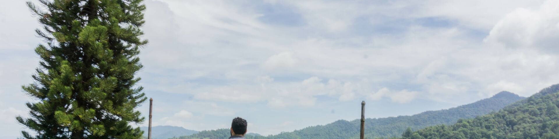 Man enjoying mountain view in San Juancito Fracismo Morazan Honduras Central America