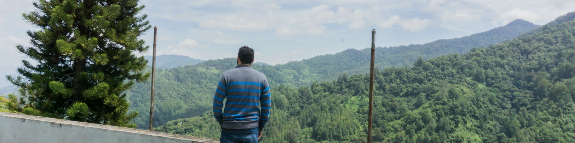 Man enjoying mountain view in San Juancito Fracismo Morazan Honduras Central America