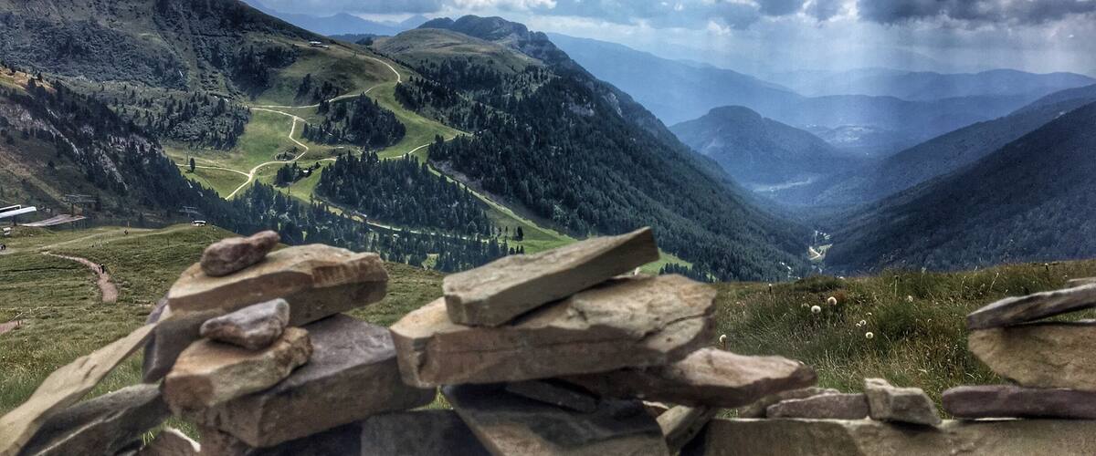 After taking the gondola and ski lift to near the top of the mountains in Predazzo it's hard not to be impressed by the view, you can even add your own stone onto one of the mountain cairns up there. The alpine lodge is a great place to stop for a drink and slice of cake too.