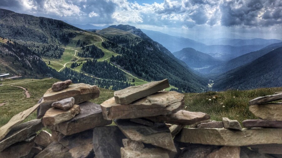 After taking the gondola and ski lift to near the top of the mountains in Predazzo it's hard not to be impressed by the view, you can even add your own stone onto one of the mountain cairns up there. The alpine lodge is a great place to stop for a drink and slice of cake too.