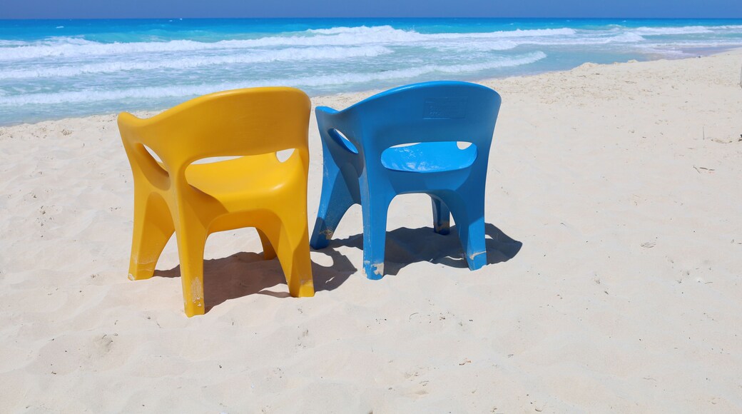 Blue and yellow chairs at sea beach, North coast of Egypt