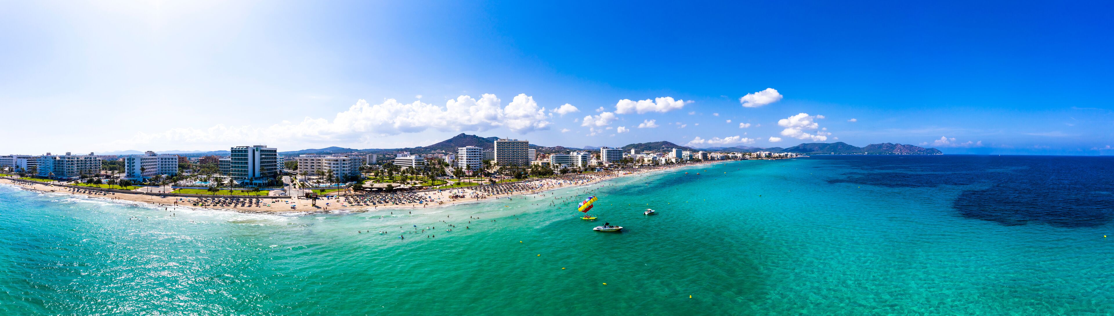 Spain, Balearic Islands,?Cala?Bona, Aerial panorama of coastline of resort town in summer