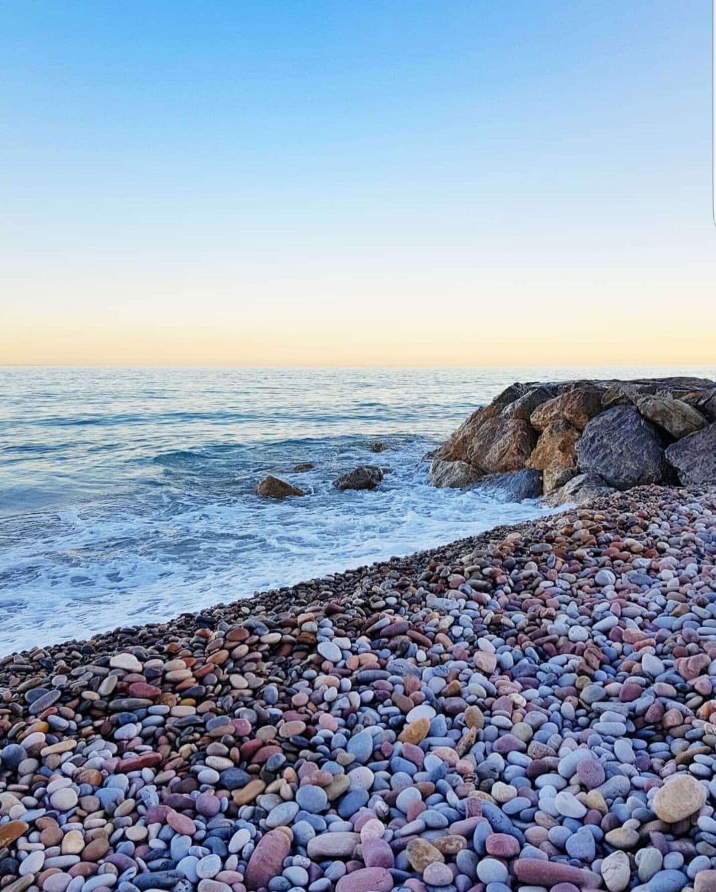 Sunset at Canet d'en Berenguer's stones beach. 