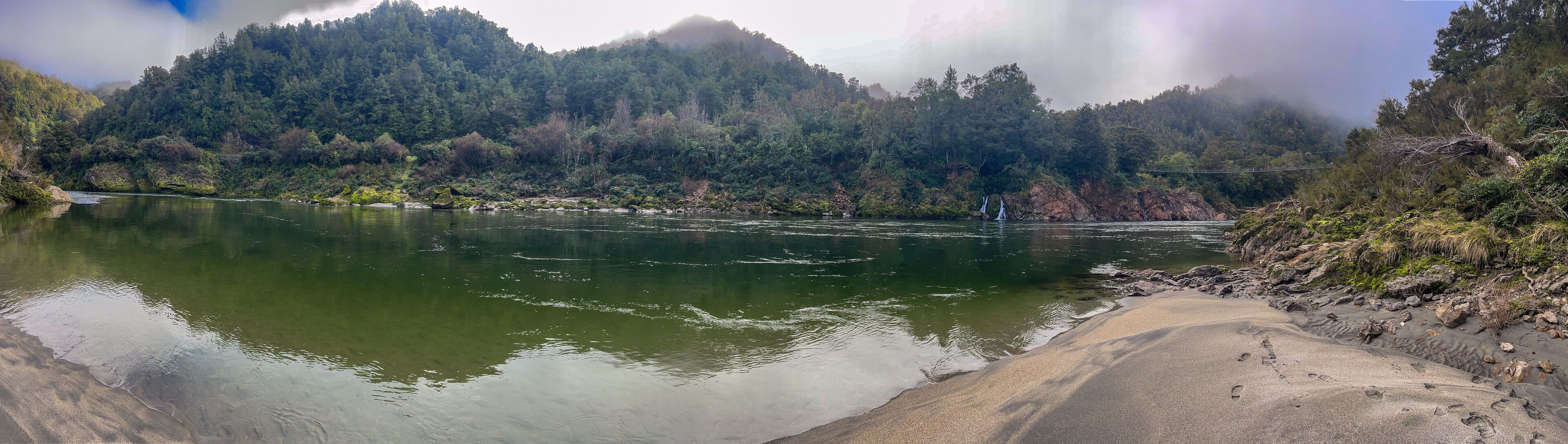The Buller river flowing through the forest covered upper Buller Gorge  near the longest suspension bridge in NZ