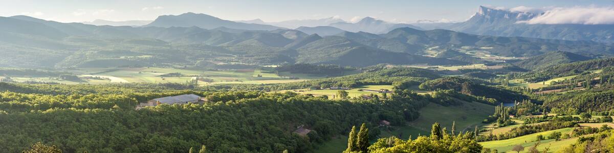 French countryside. View over the mountains (Trois Becs, Plateau des Chaux, Grand Barry et la Servelle) of the Drôme in France.
